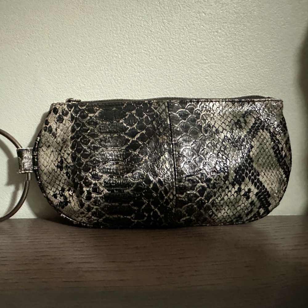 Snake skin pattern wristlet. Green, black and cream colored. Gently used.